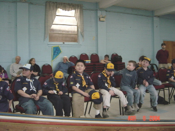 Pinewood Derby 2004 -- with me in the background, near the door