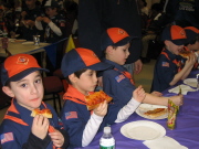 Tigers devouring pizza in the concrete jungle